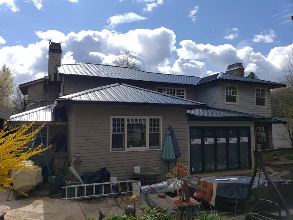 Dark standing seam metal roof on a residential home